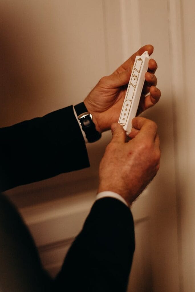 mezuzah A mezuzah is a small scroll written in biblical Hebrew and placed on a doorway.