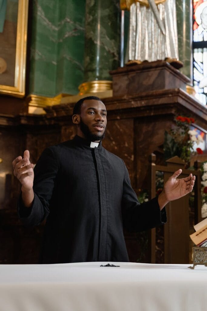 A Priest in Black Vestment.