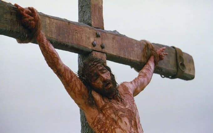 Jesus bad beaten and hanging on the cross before the resurrection